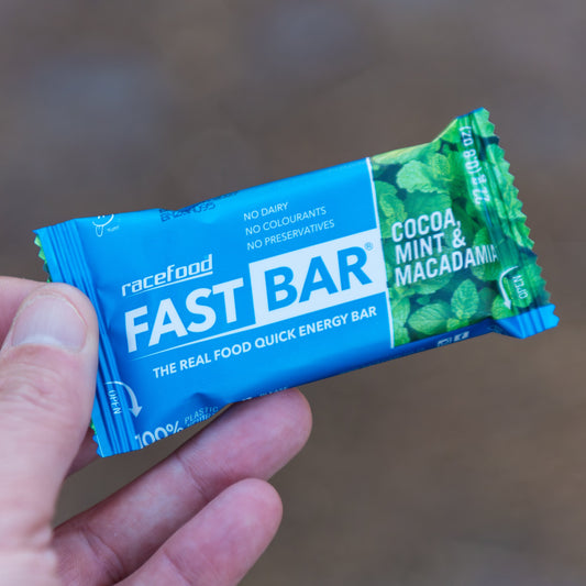 Racefood Fast Bar Cocoa, Mint & Macadamia held in hand